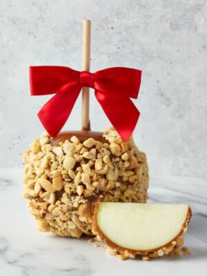 1 Chocolate Caramel Apple Peanut with a red bow and apple wedge.