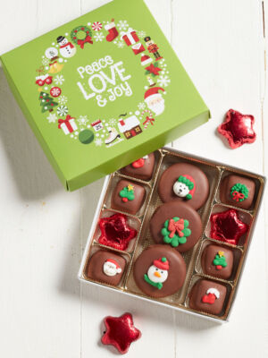 Green Holiday Binge box filled with an 11pc chocolate assortment of caramels, cookies and foiled stars.