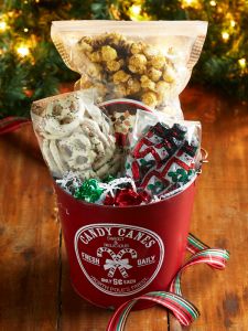 Red holiday chocolate Pail full of christmas chocolates and snacks