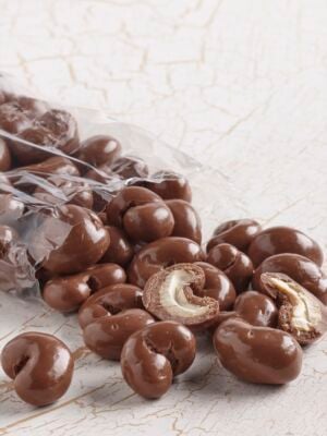 clear bag of milk chocolate covered cashews