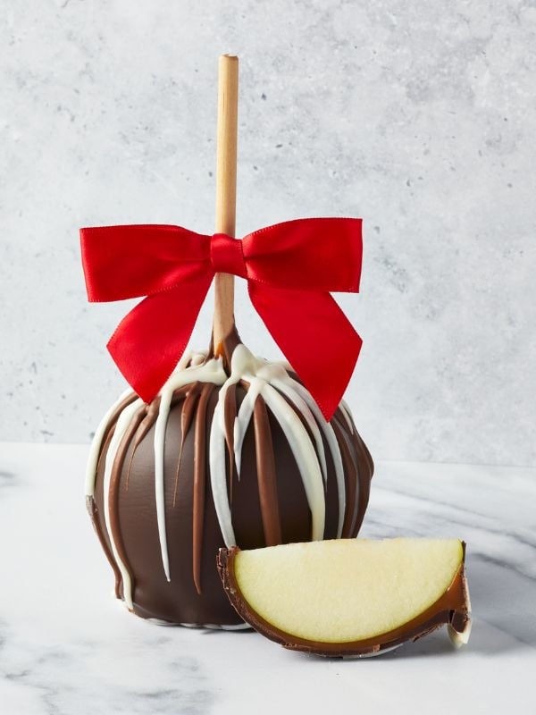 1 Triple Chocolate Caramel Apple with a red bow and apple wedge.