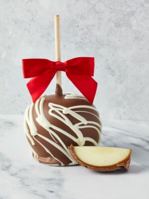 Chocolate Caramel Apple with a red bow and apple wedge