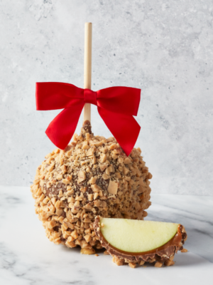 Chocolate Caramel Apple Toffee with a bow and an apple wedge.