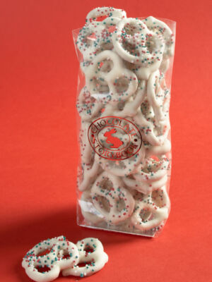 bag of white chocolate holiday pretzels coated in red, white and green sprinkles