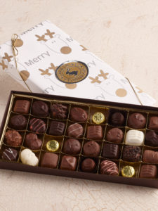 1 lb. holiday chocolate assortment wrapped in festive paper